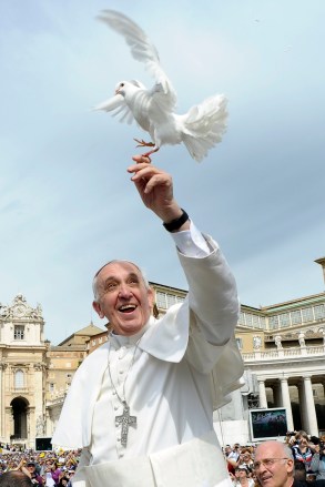 Pope Francis holds dove before his weekly audience at the Vatican